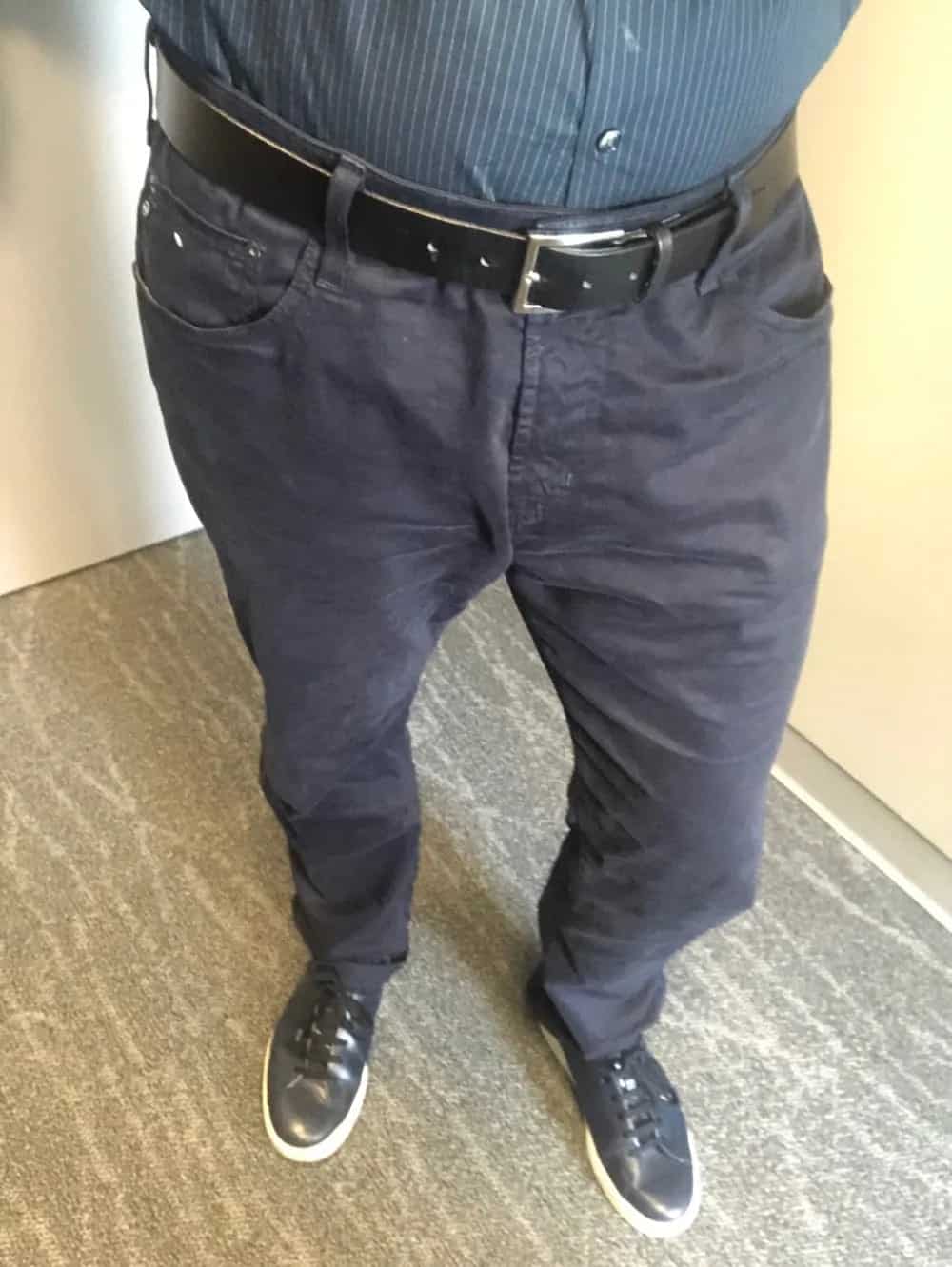 AG 5-pocket blue cotton pants for men with tucked shirt.