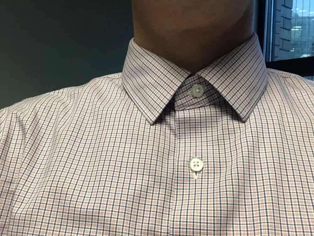 Standard collar style. Neither spread nor pointed. The collar is kept stiff with plastic strips.