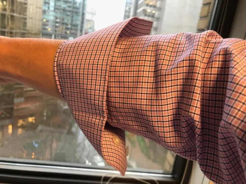 I like wearing my dress shirts with the cuff flipped up one time like this. The cuff is sufficiently stiff to stay in a flipped position (instead of folding down like other shirts with soft cuffs).