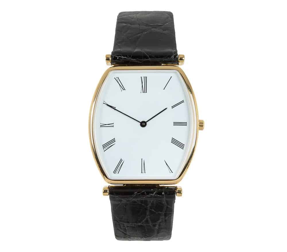 Analog watch with black leather strap.