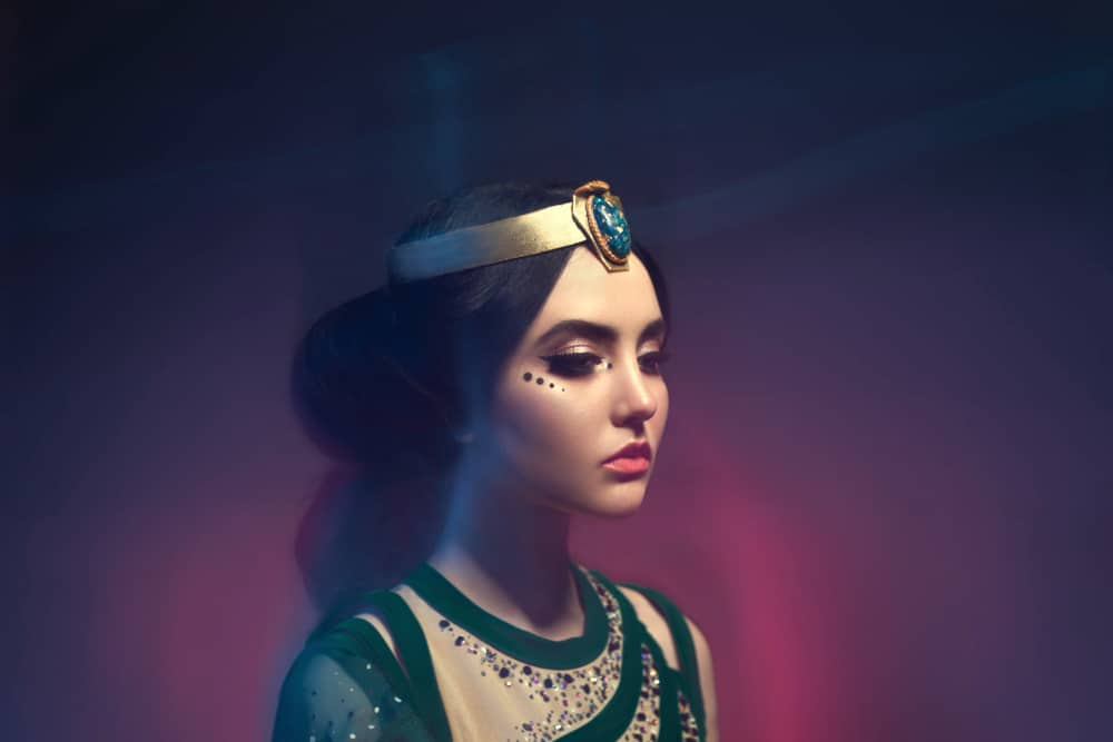 Queen wearing circlet.