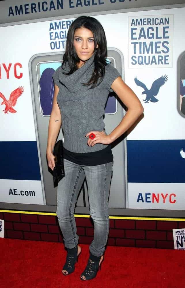 Jessica Szohr wearing a cowl neck sweater.