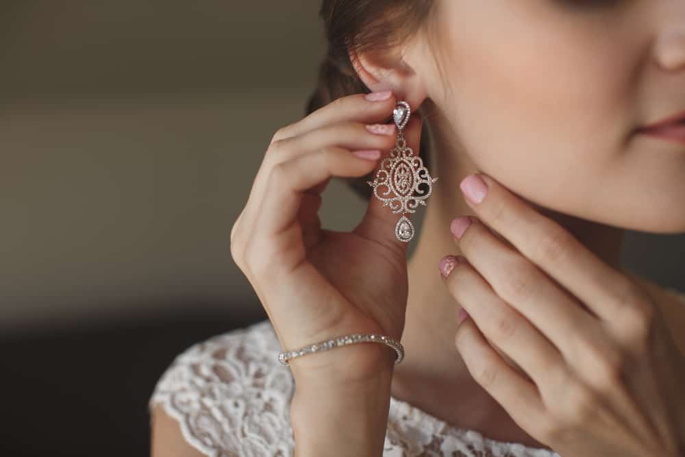 Bride wearing a dangling earring.