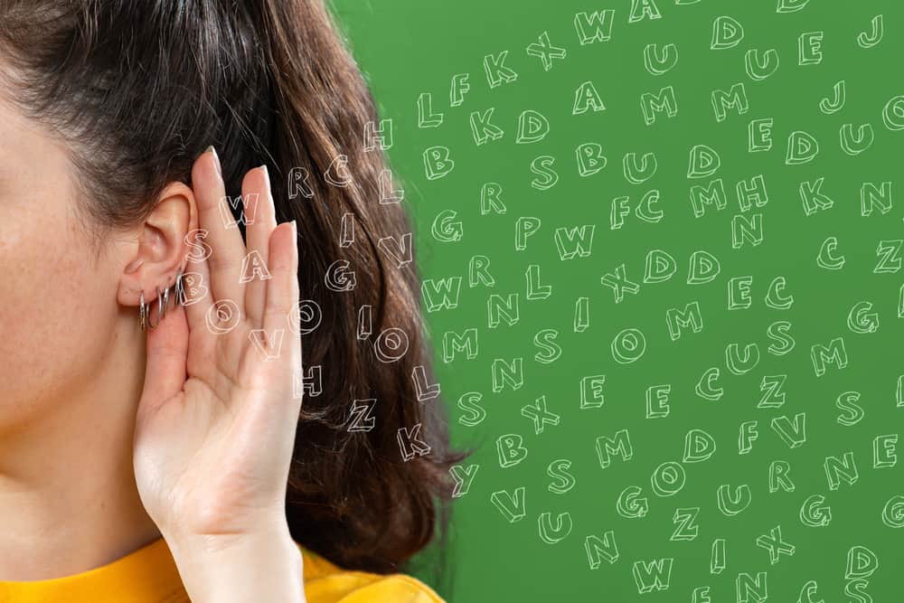 Woman showing her piercings.
