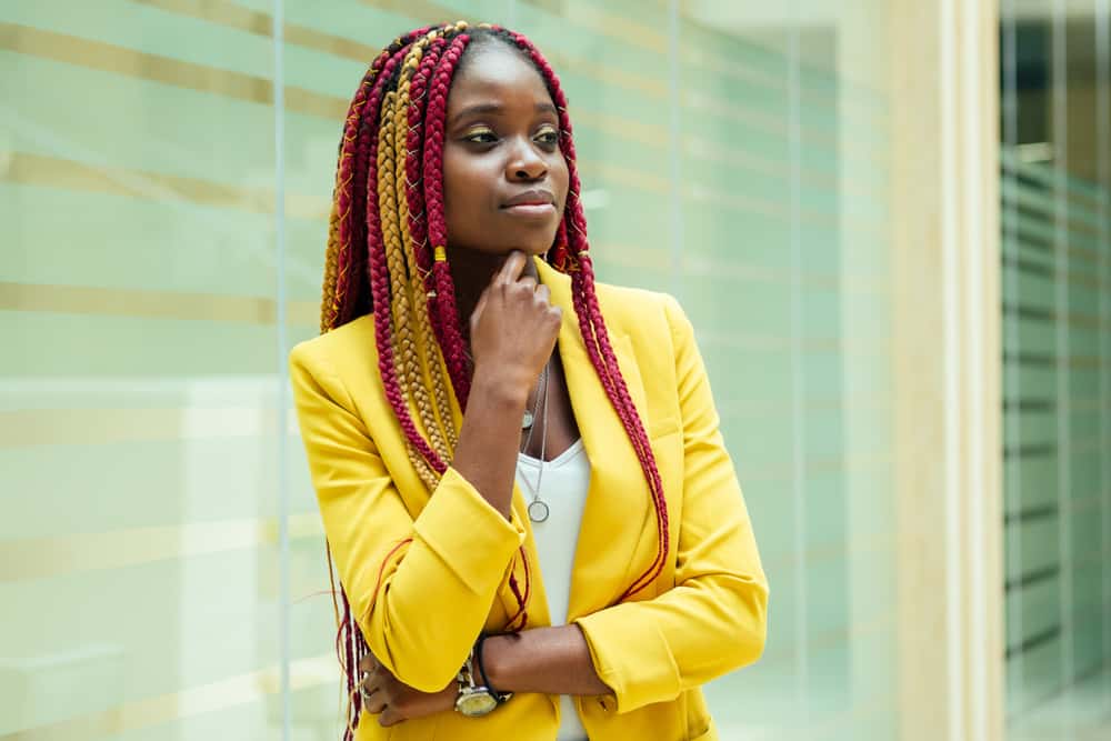 Woman with kanekalon hair styled with hair rings.