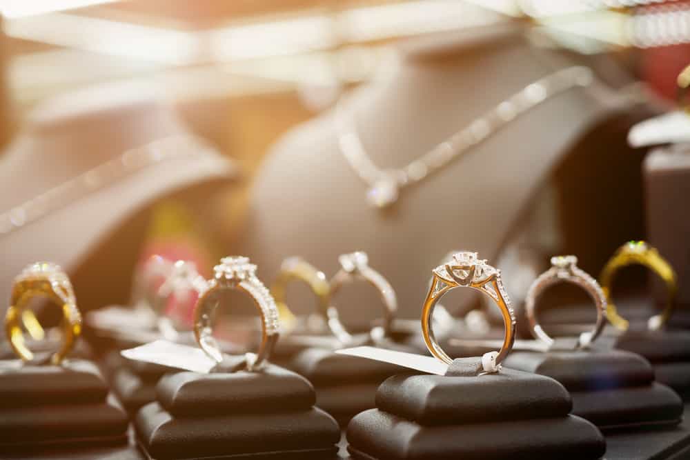 Diamond rings and necklaces inside a jewelry store.