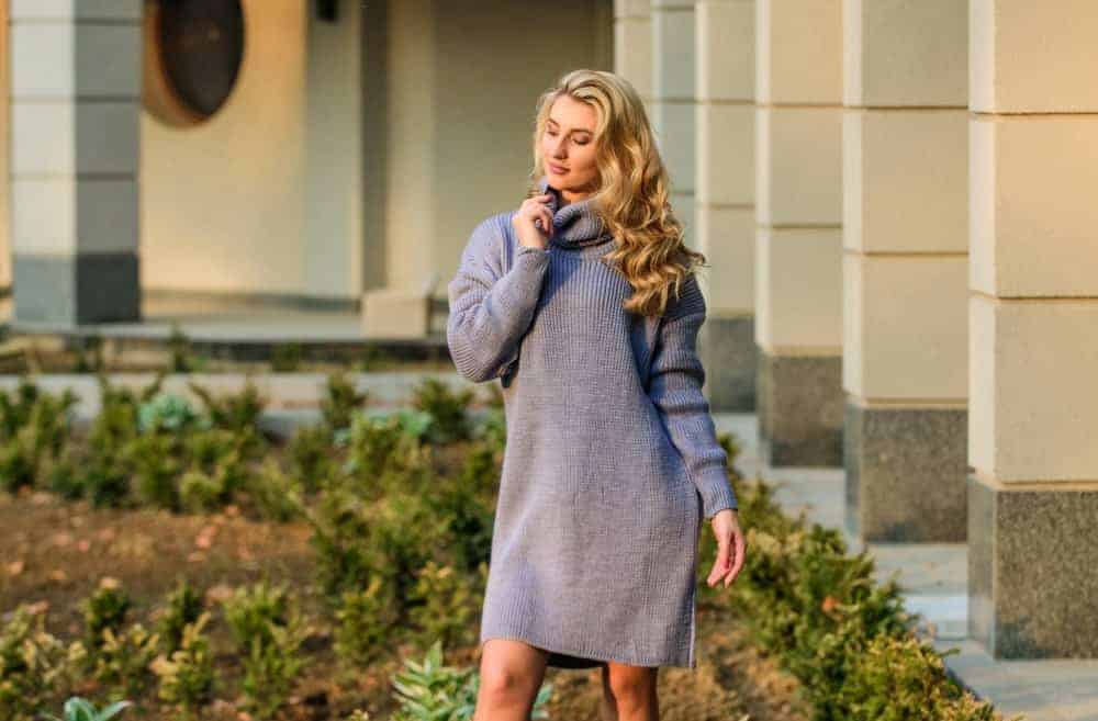Woman wearing a sweater dress.