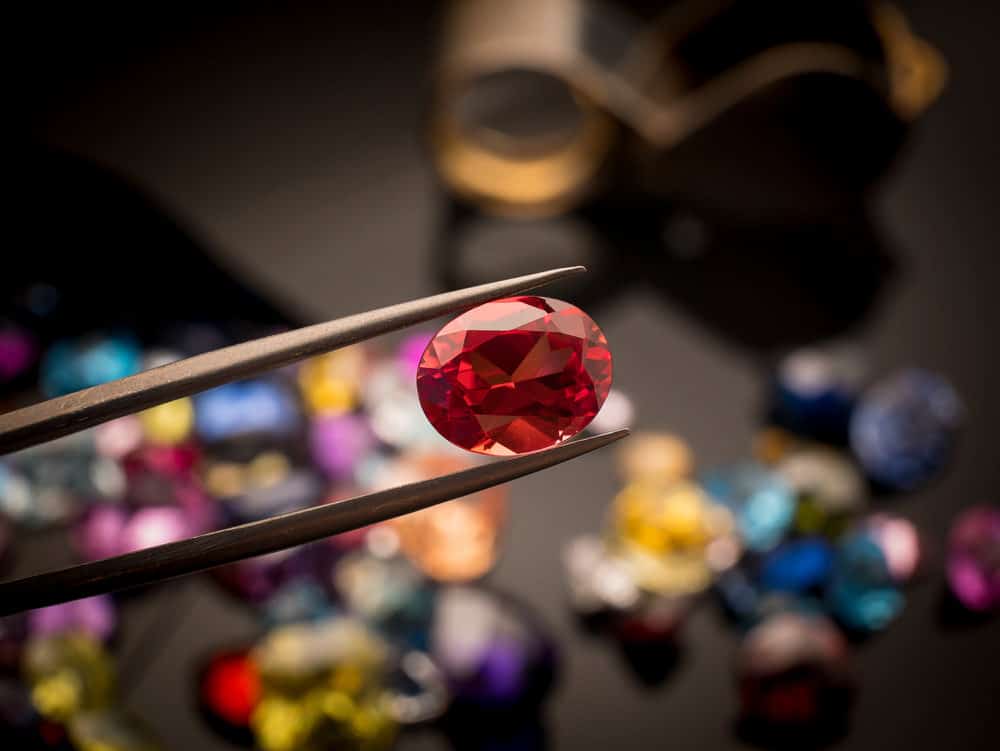 A ruby gem up close held for inspection.
