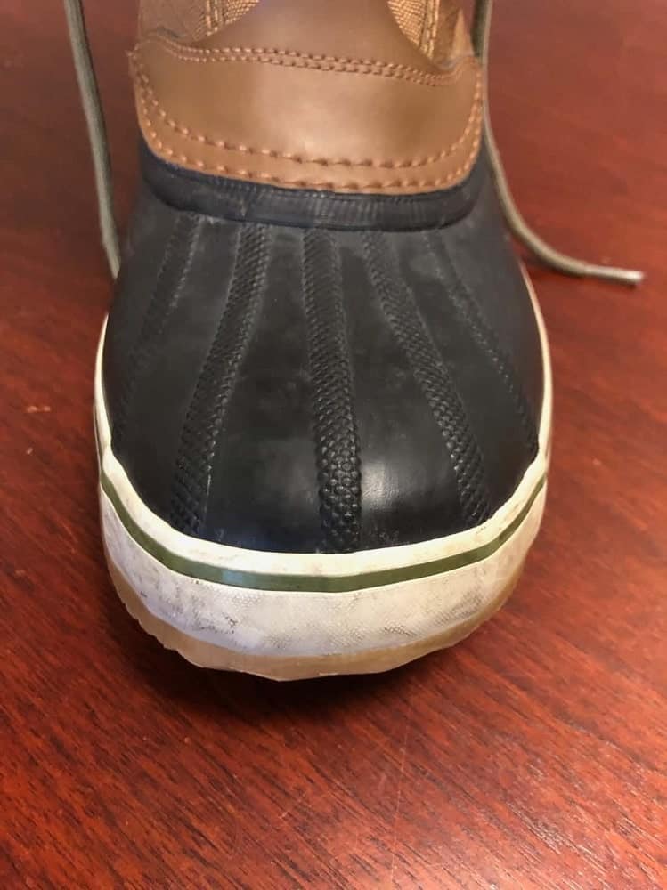 Close-up photo of Sorel Caribou boots vulcanized rubber base (front-view).