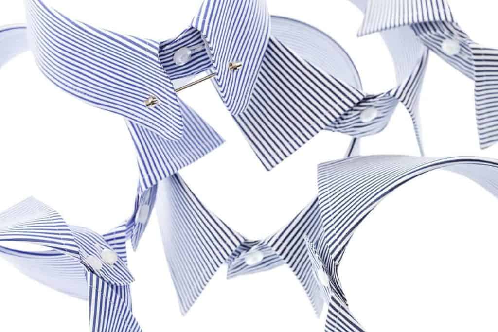 A variety of collars on a white surface.