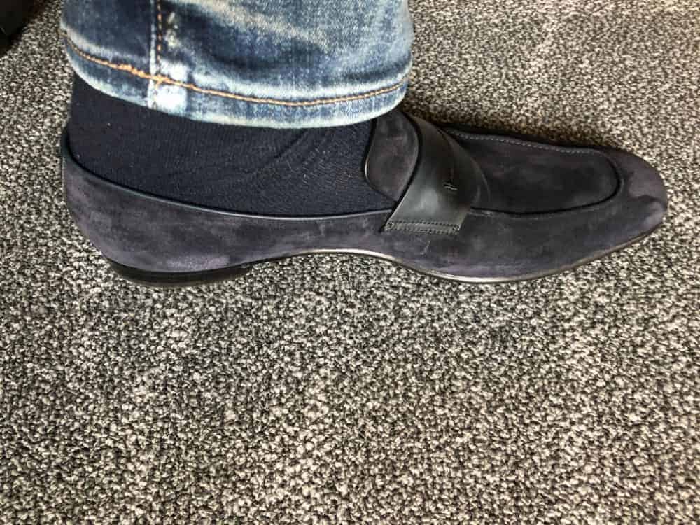 Inside view of blue Zegna suede loafer with jeans on.