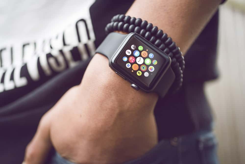 A close look at a man wearing a smartwatch.