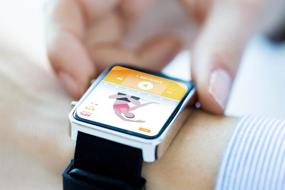 A close look at the smartwatch with a black strap.