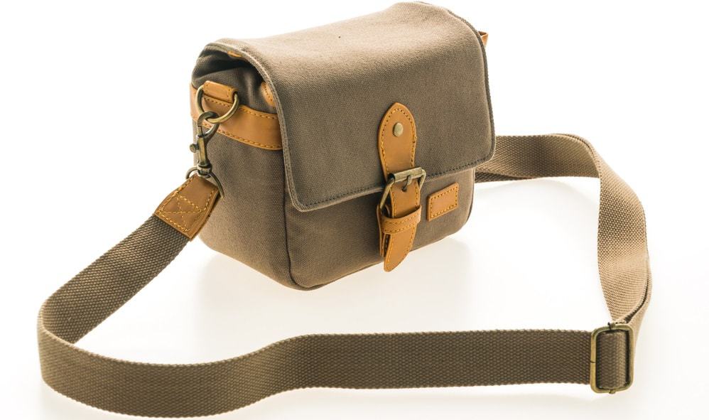 A close look at a green linen Messenger bag.