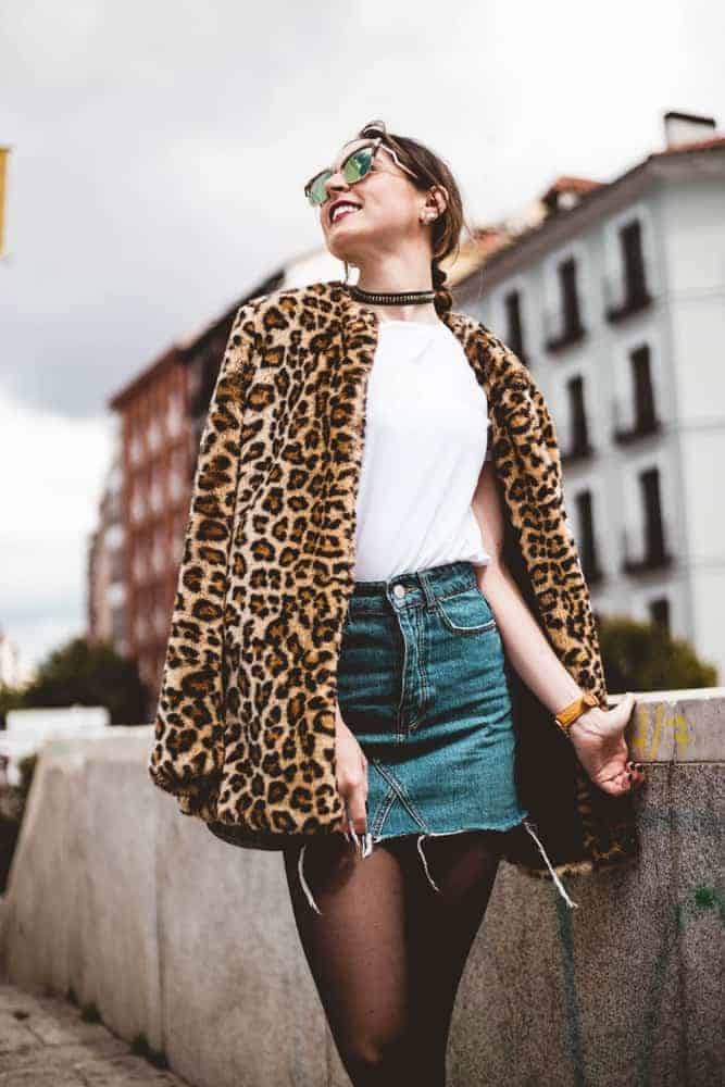 A woman wearing a bold animal print jacket.