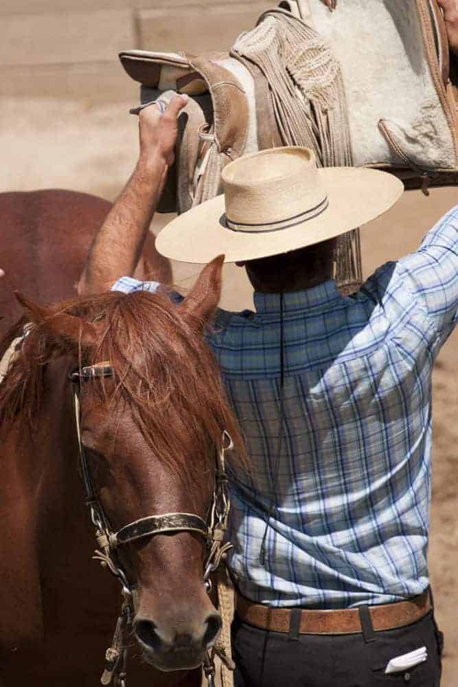 Man wearing chupalla hat.