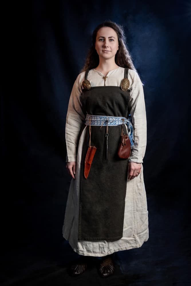 Woman in an apron dress.