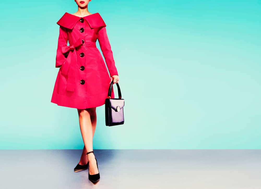 Woman in a red trench coat.