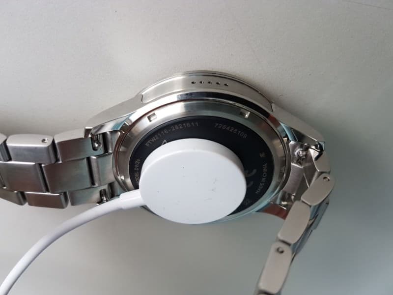 Fossil Q Founder 2 smartwatch with charger attached