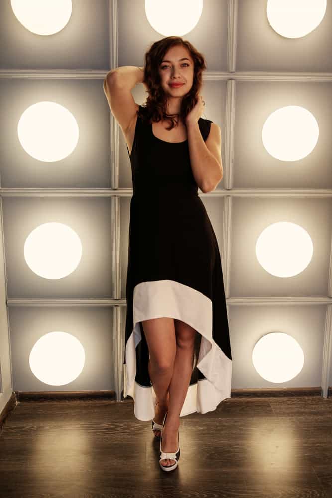 Model wearing a high low dress.