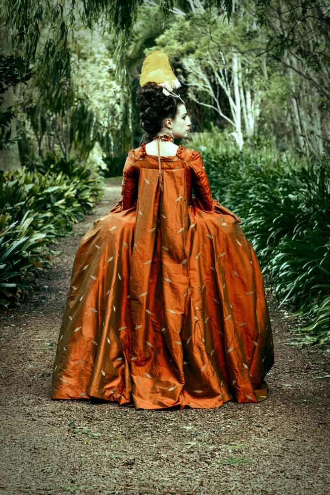 Georgian woman wearing a silk sack-back gown.