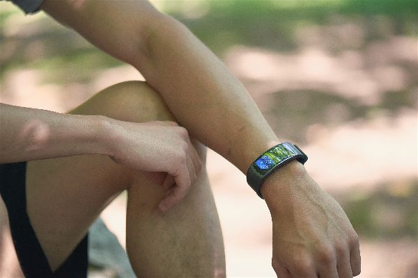 A man wearing the Samsung Gear Fit 2 Smartwatch.