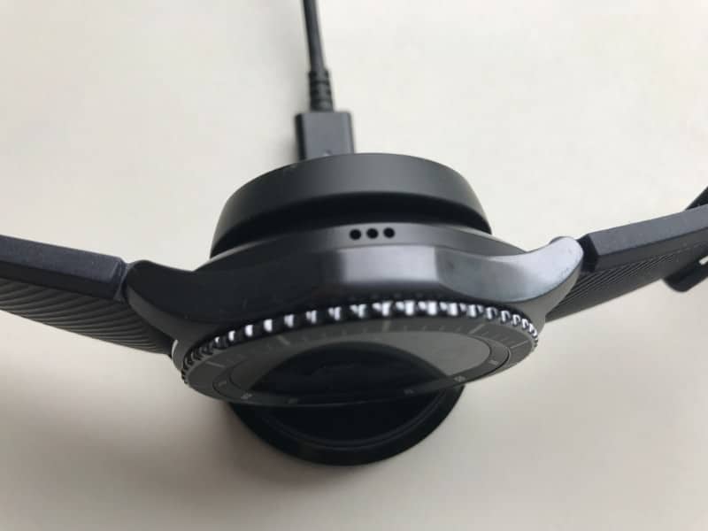 Front view of Samsung Gear S3 Frontier attached to charger