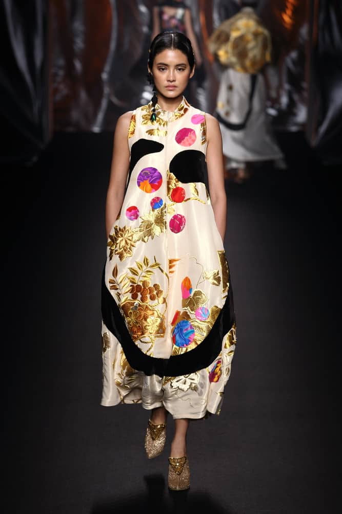 Model wearing a colorful tent dress during Bangkok International Fashion Week.