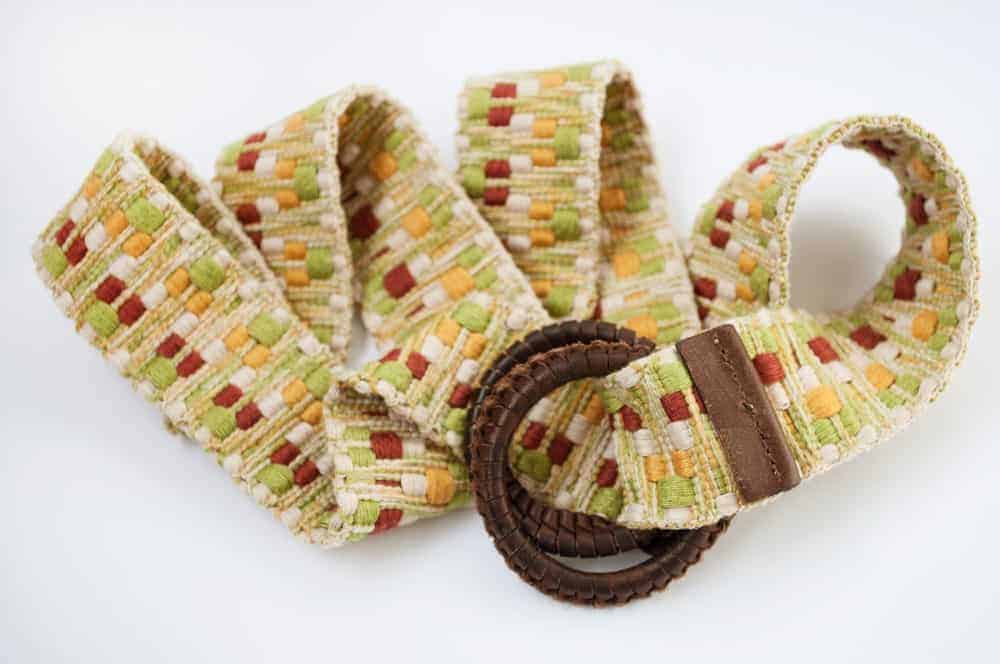 A close look at a colorful woven women's belt.