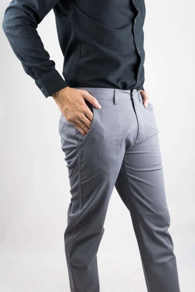A close look at a man wearing light gray chinos.