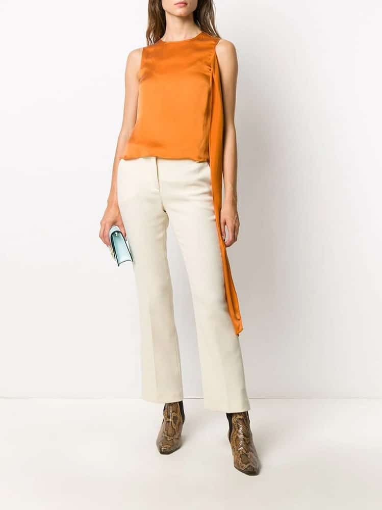 A close look at a pair of light beige slim pants chino.