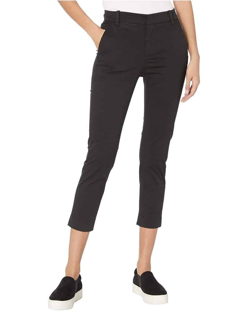 A woman wearing a pair of skinny chinos.