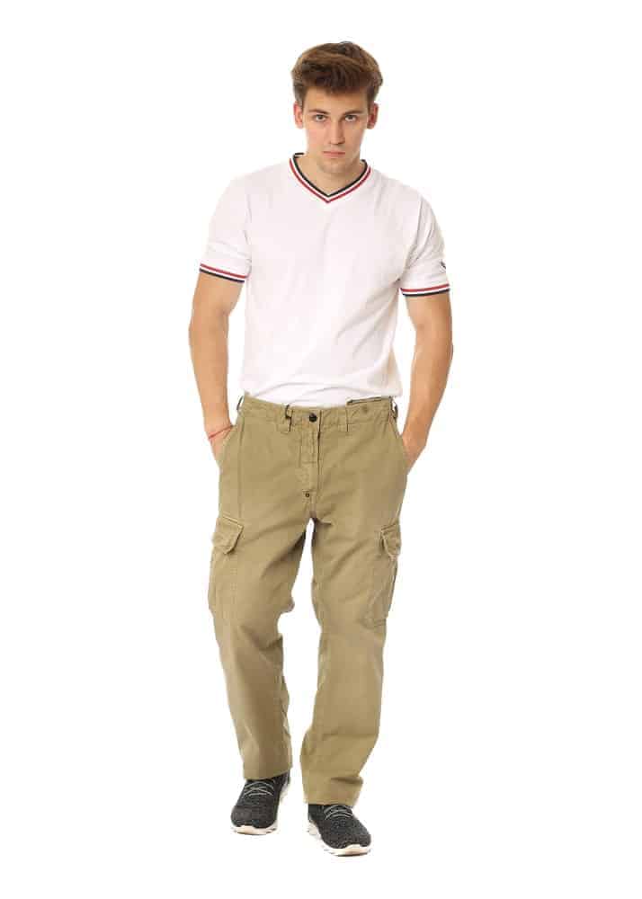 A man wearing a white shirt with his khaki pants.