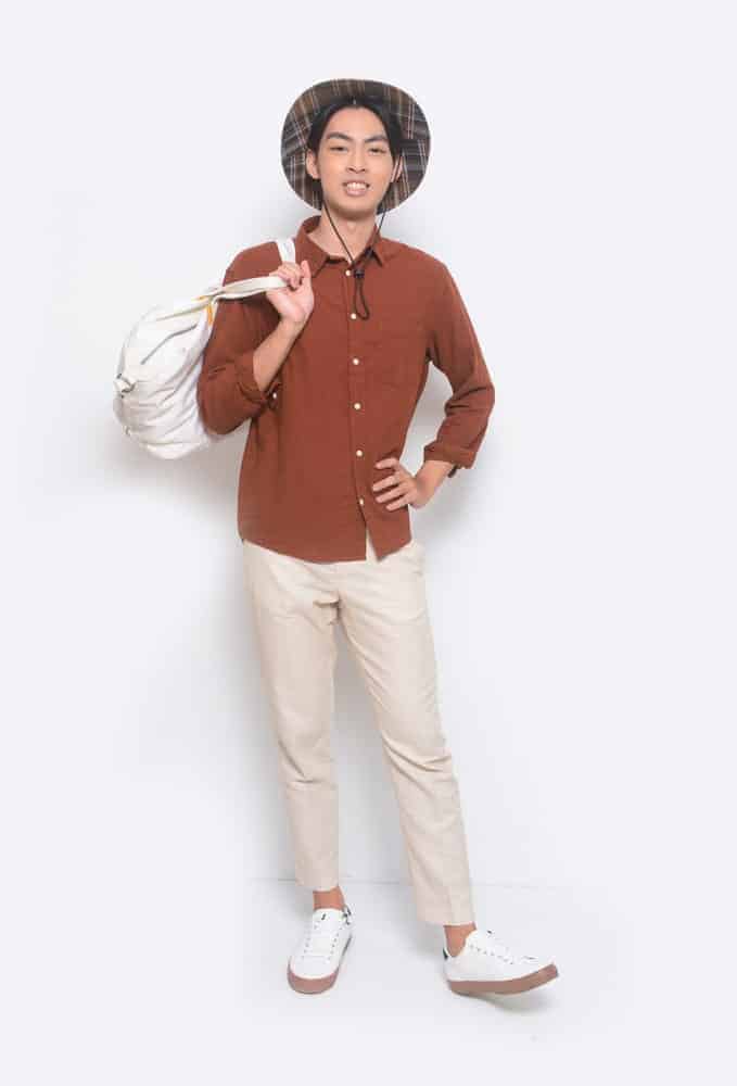 A close look at a man wearing slim fit khaki pants.