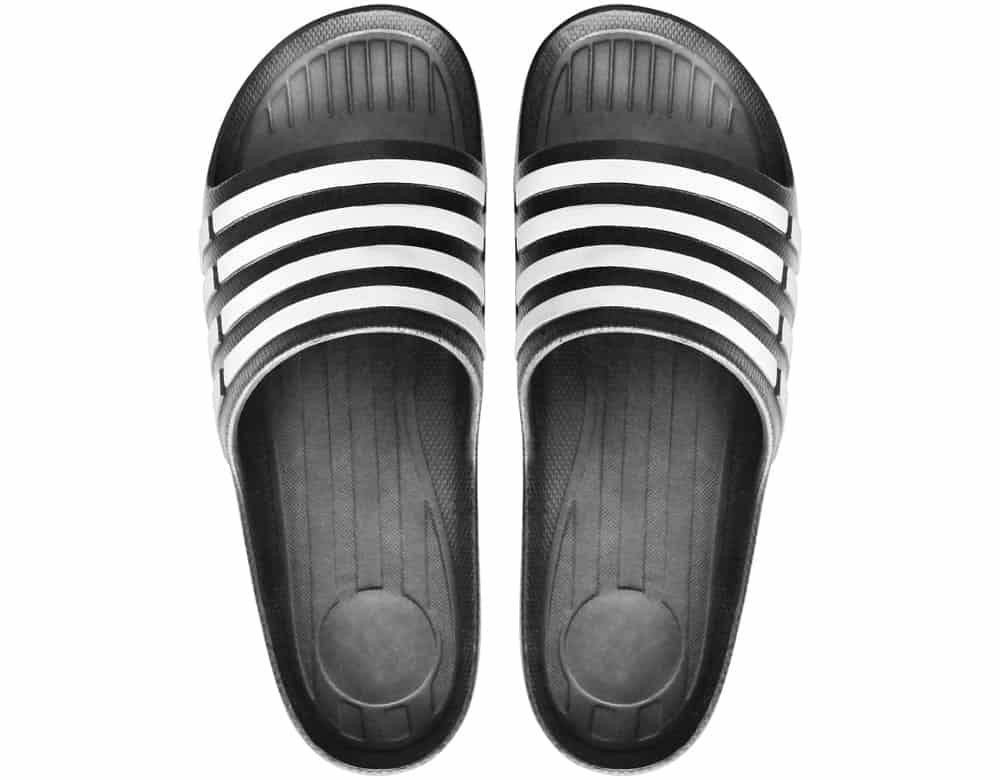 A pair of black and white rubber sandals.