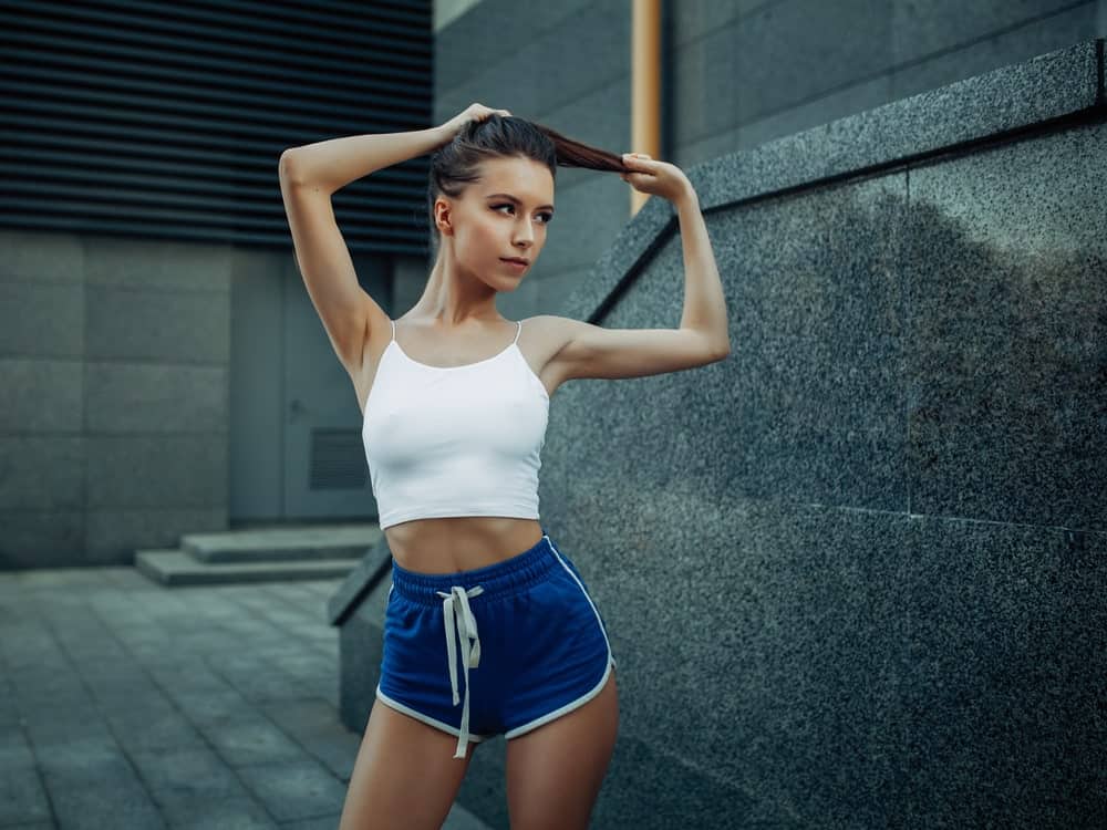 A close look at a woman wearing slim fit shorts.