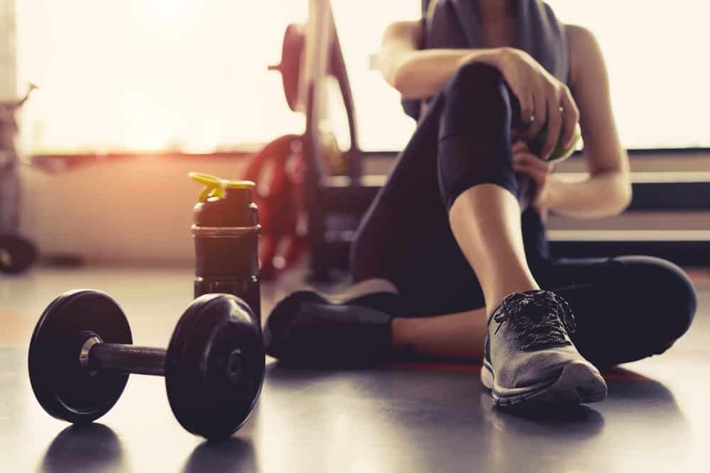 A woman wearing workout pants at the gym.
