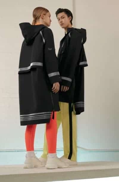 Couple wearing black Anorak jackets.