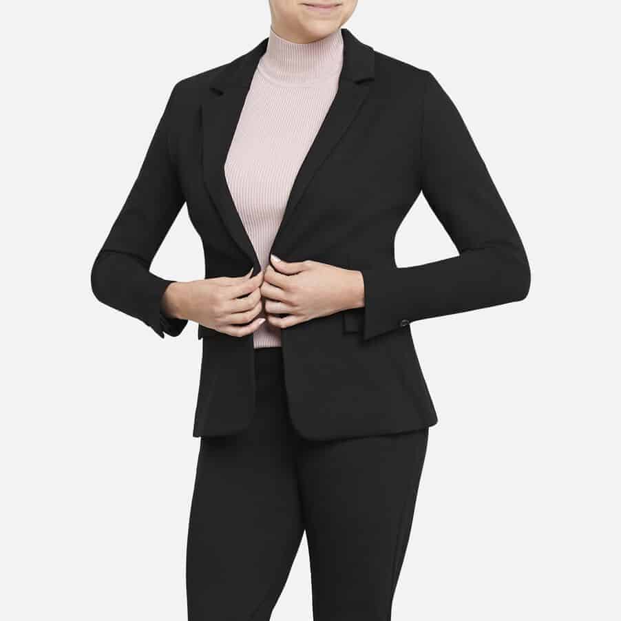 Woman wearing blazer.