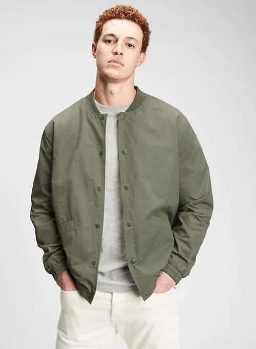 Man wearing a green bomber jacket.