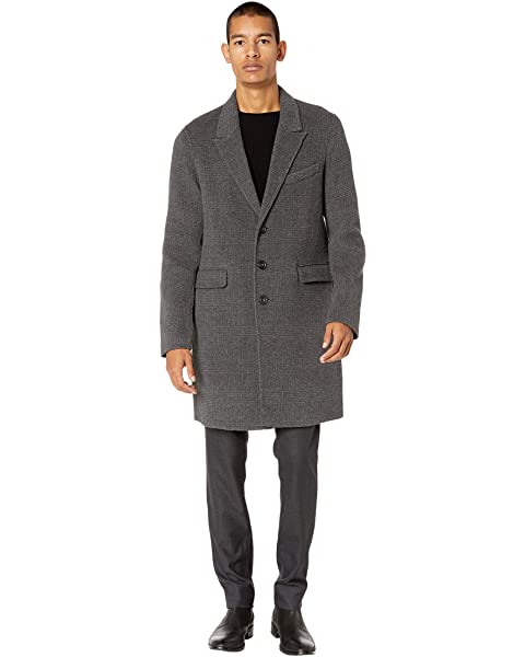 Man wearing a car coat.