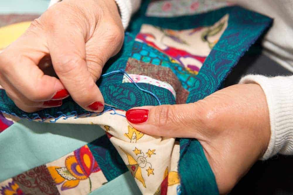 A close look at a quilt being made.