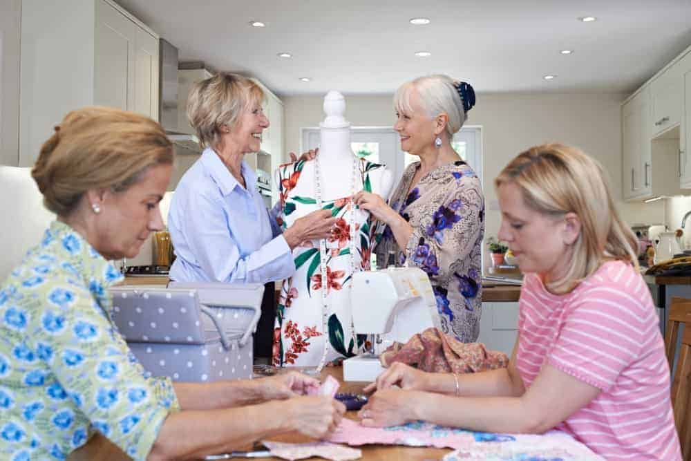 A group of women making a quilt together.