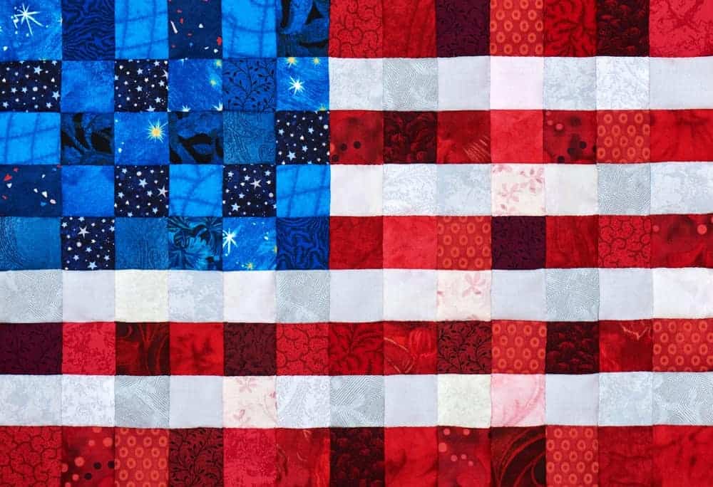 A colorful quilt in a patriotic design.