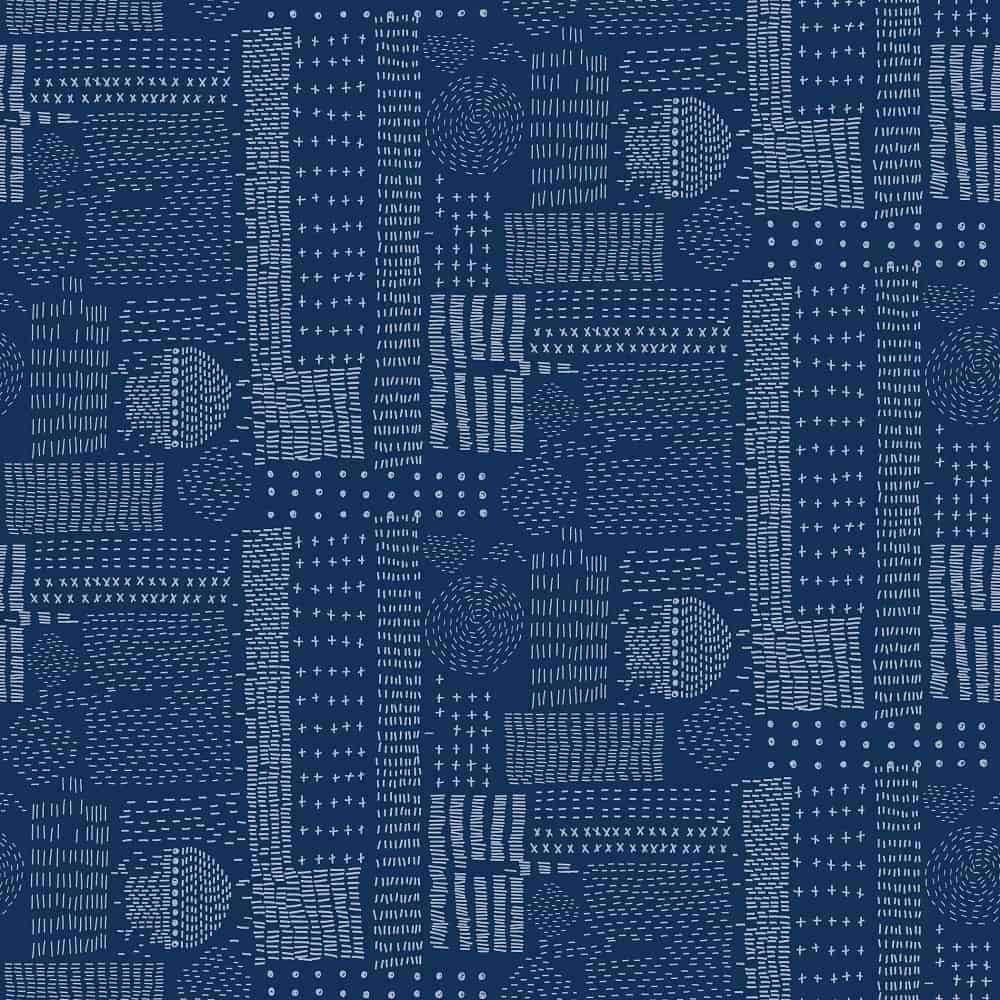 A close look at the pattern of a sampler quilt.