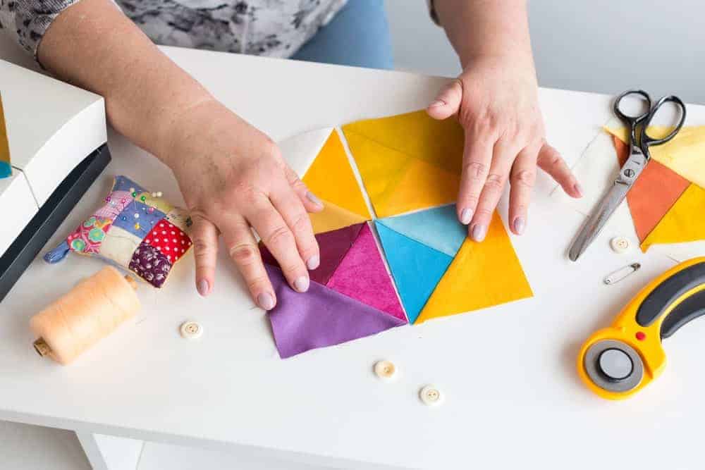 A close look at a quilt pattern with colors laid out.