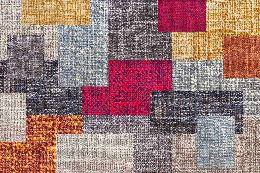 A colorful patchwork quilt with uneven pattern.