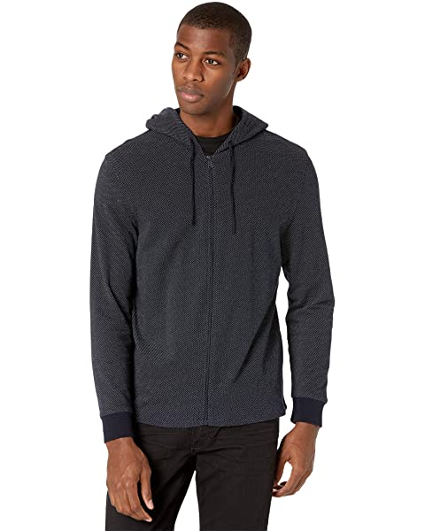 Man wearing a zip-up hoodie.