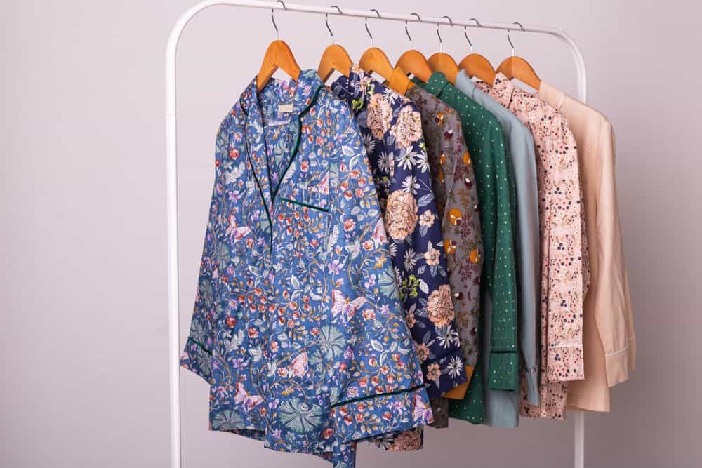 Ladies pajamas on hangers in a store.