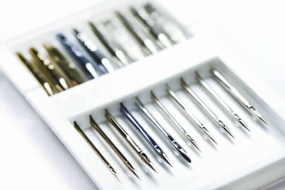 This is a close look at the set of various needles for the sewing machine.
